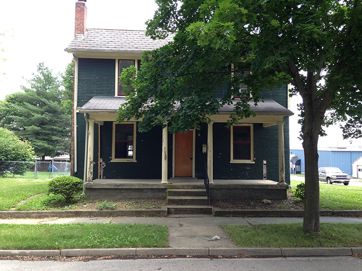 wood door, cream trim and columns