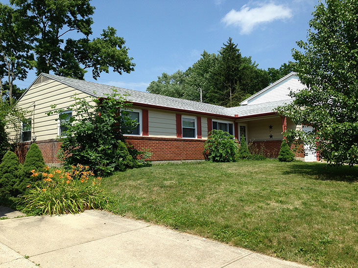 red brick, cream siding, ranch style
