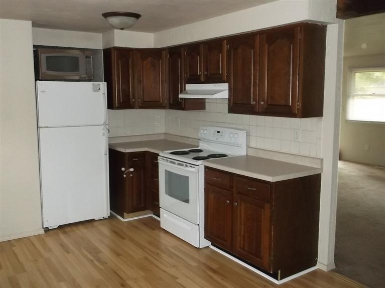 Cape Cod style, driveway, garage in rear