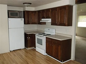 Cape Cod style, driveway, garage in rear