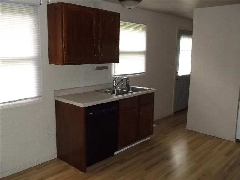 Cape Cod style, driveway, garage in rear