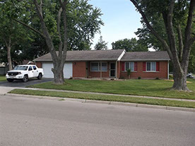 Cape Cod style, driveway, garage in rear