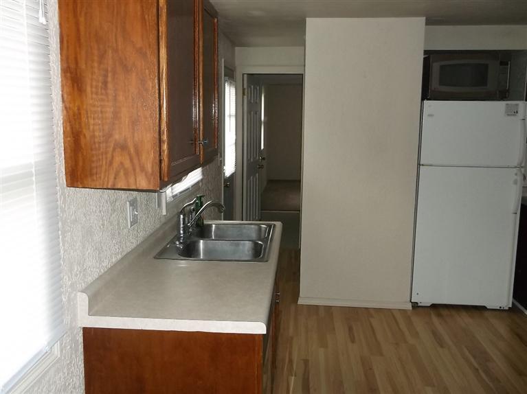 Cape Cod style, driveway, garage in rear