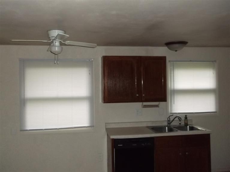 Cape Cod style, driveway, garage in rear