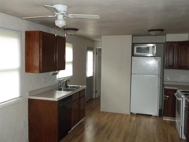 Cape Cod style, driveway, garage in rear