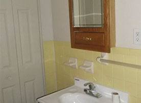 Cape Cod style, driveway, garage in rear