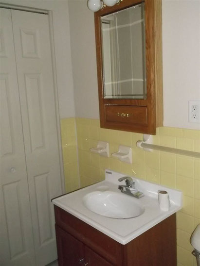 Cape Cod style, driveway, garage in rear