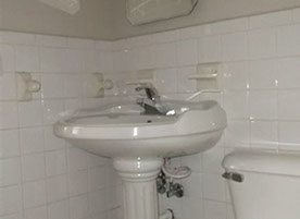 Cape Cod style, driveway, garage in rear