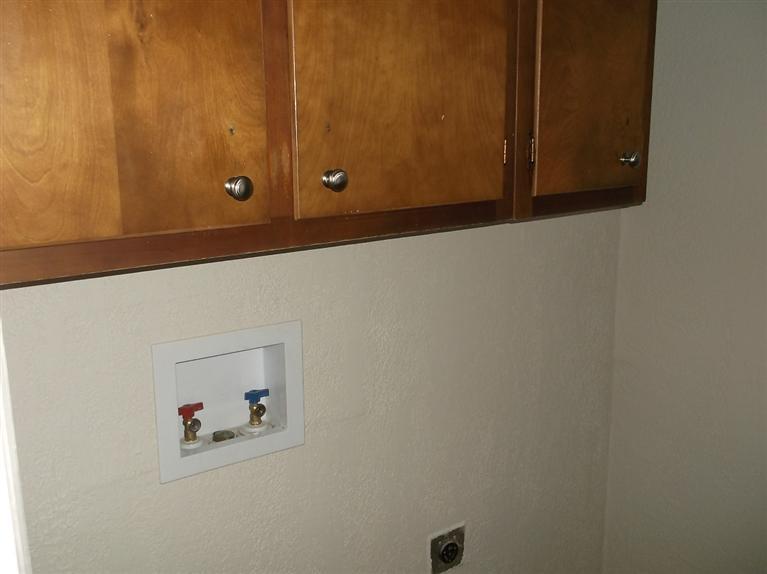 Cape Cod style, driveway, garage in rear