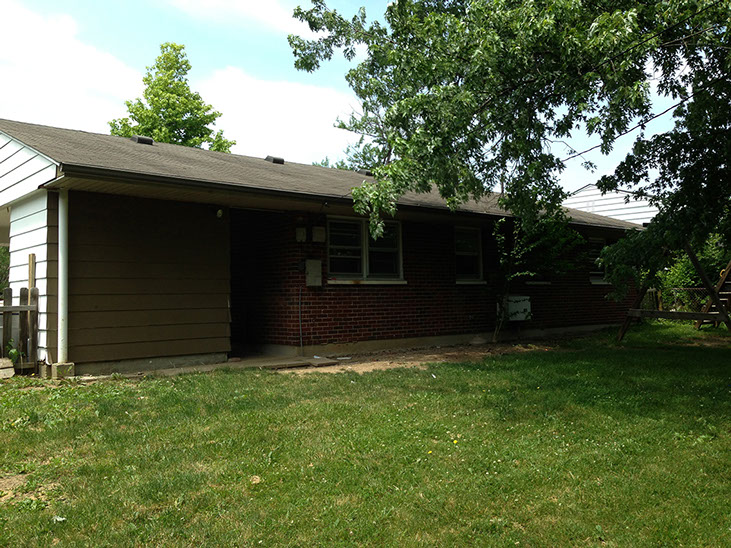 red brick and white siding ranch style