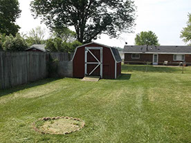 Cape Cod style, driveway, garage in rear