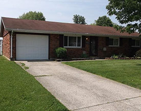 Cape Cod style, driveway, garage in rear