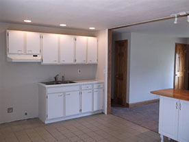 Cape Cod style, driveway, garage in rear