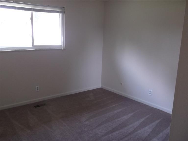 Cape Cod style, driveway, garage in rear