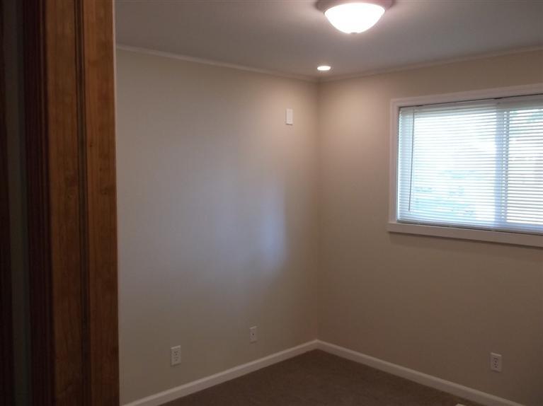 Cape Cod style, driveway, garage in rear