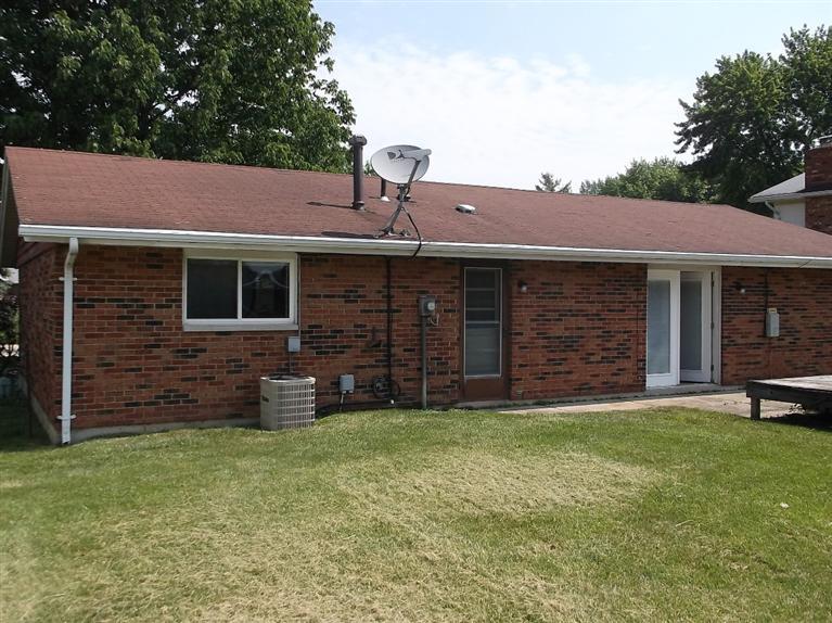 Cape Cod style, driveway, garage in rear