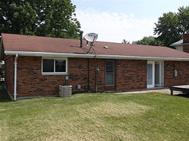 Cape Cod style, driveway, garage in rear