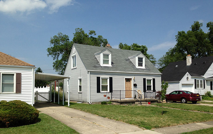 small front patio, black railing, black shutters