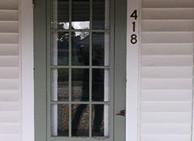 Cape Cod style, driveway, garage in rear