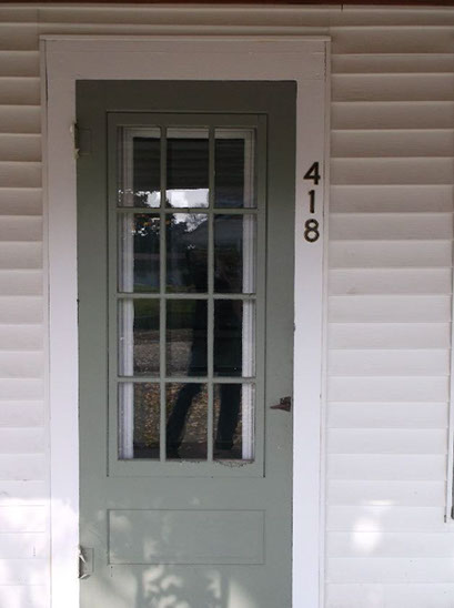 Cape Cod style, driveway, garage in rear