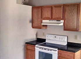 Cape Cod style, driveway, garage in rear